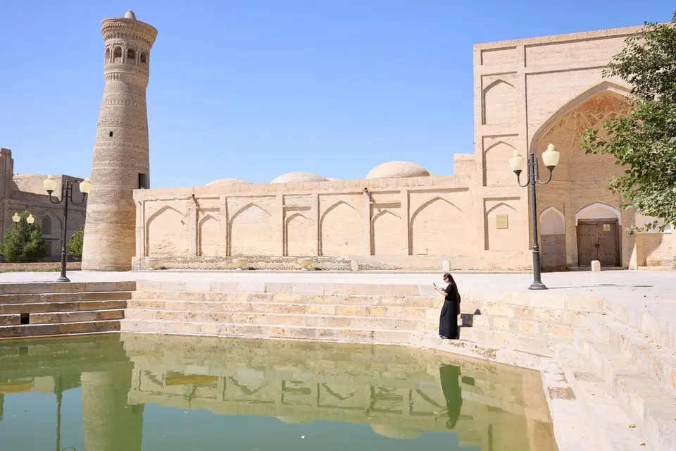 Stone pool and minaret in Bukhara old town