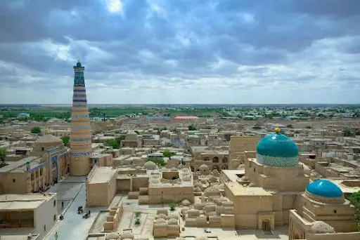 Islam Khoja minaret above the flat roofs of Khiva